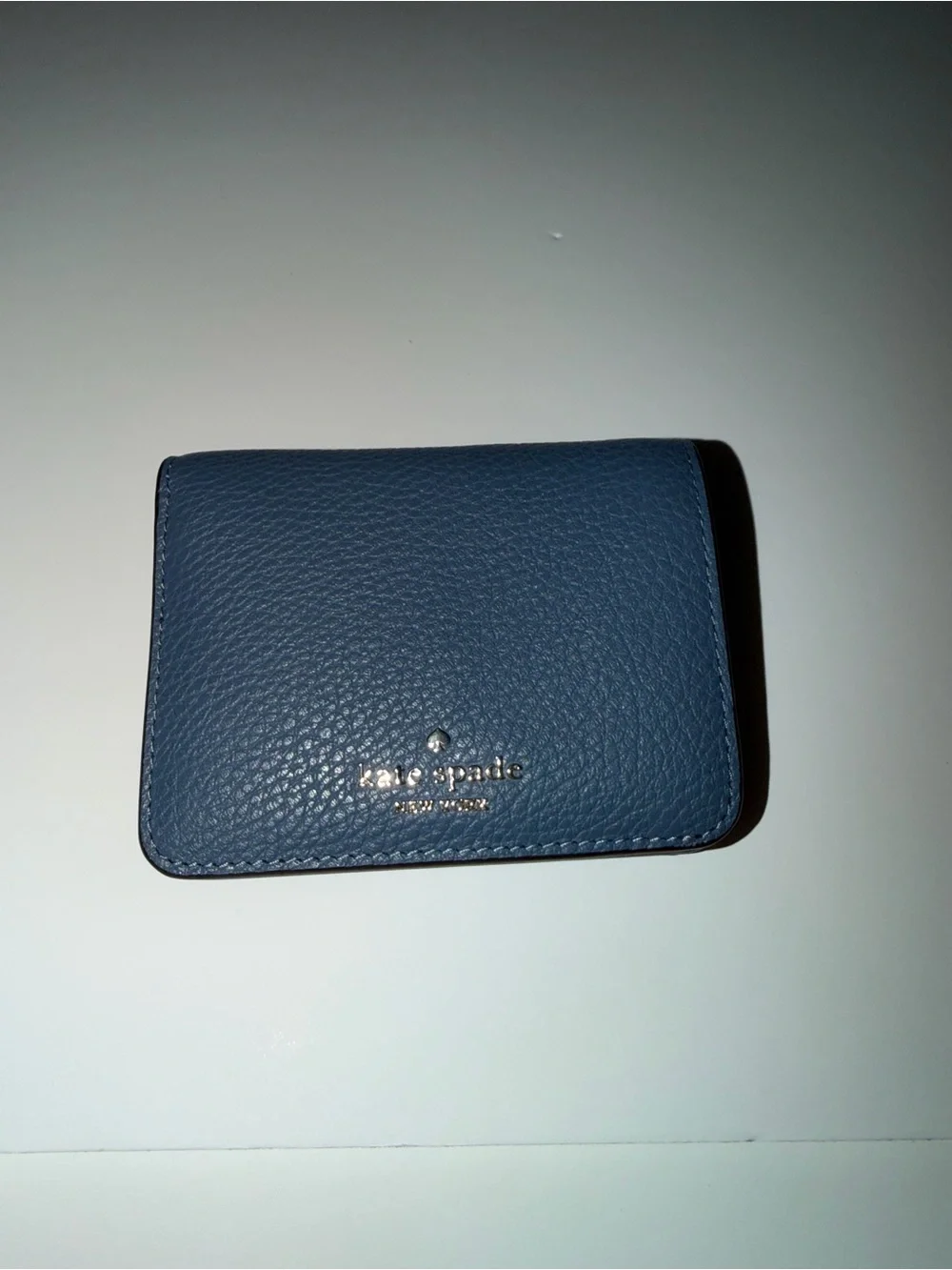 Kate Spade New York blue leather wallet with pebbled texture